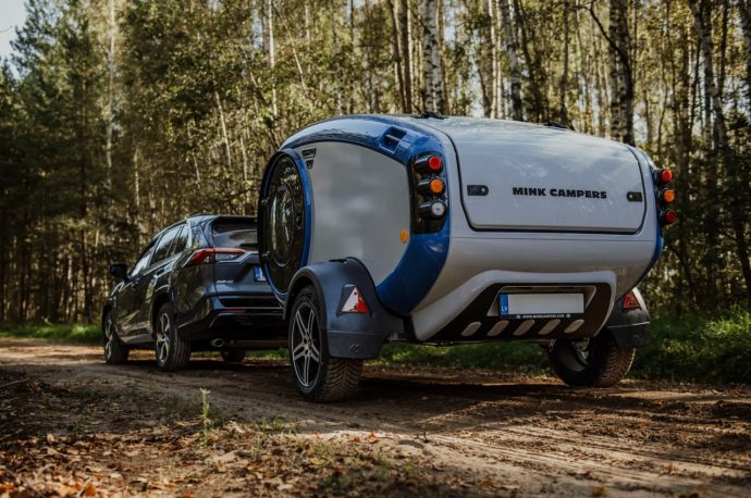 MINK-E all-electric teardrop trailer in vibrant blue theme is an oasis of comfort for off-grid camping