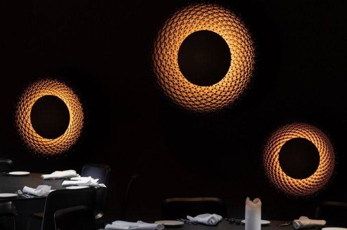 Sculptural wall lamps bring an otherworldly aura inspired by sunflowers