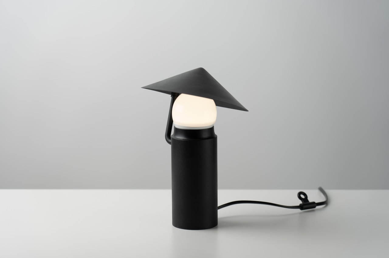 #Cute table lamp concept mimics a man with an umbrella under the rain