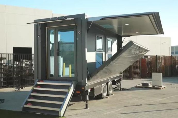 Portable tiny home can expand into a 364 square feet living space