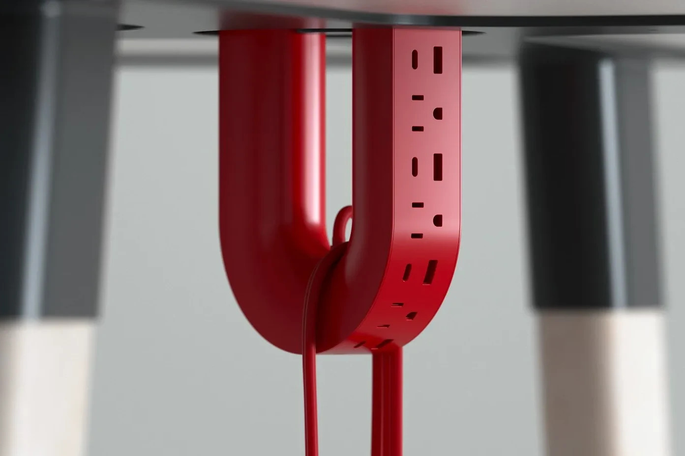 U-shaped power strip concept has an interesting cable management trick