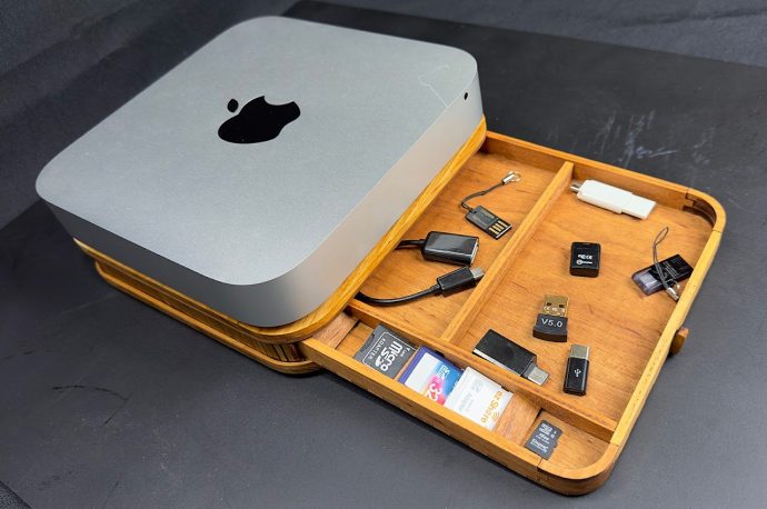 Mac mini wooden organizer stand uses a mini tambour door to hide your stuff