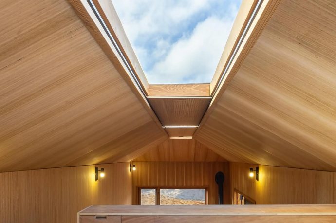 Featuring Two Massive Skylights, This Wooden Tiny Home Opens Up To The Skies