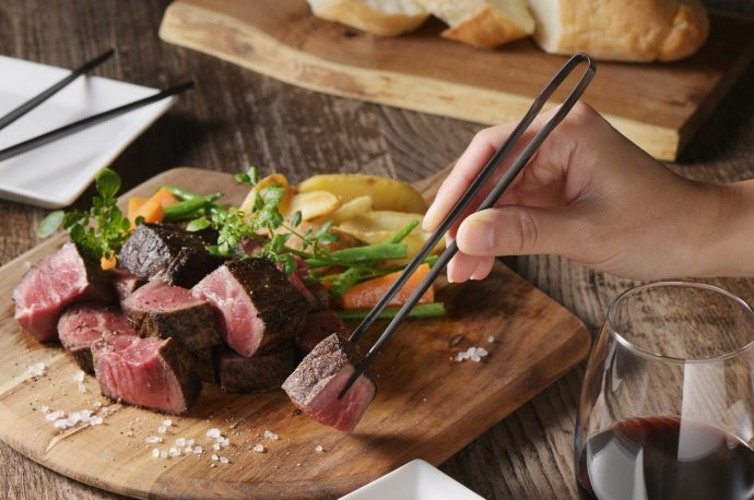 Chopstick-shaped tongs make cooking, serving, and eating a breeze