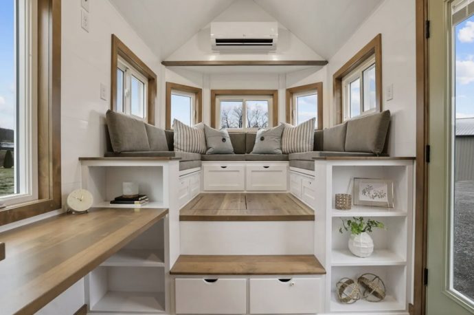 A Raised Living Area With Integrated Storage Makes This Tiny Home More Functional & Unique Than It Looks