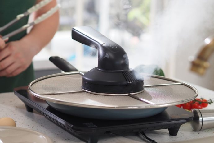 Saucepan Lid with a Built-in Chimney to filter fumes might be the most brilliant idea of the decade