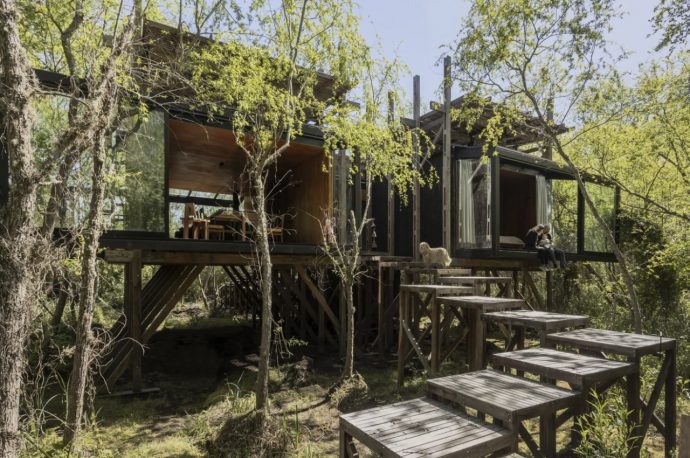 Raised On Stilts, This Wooden Home Features An Interesting Elevated Layout