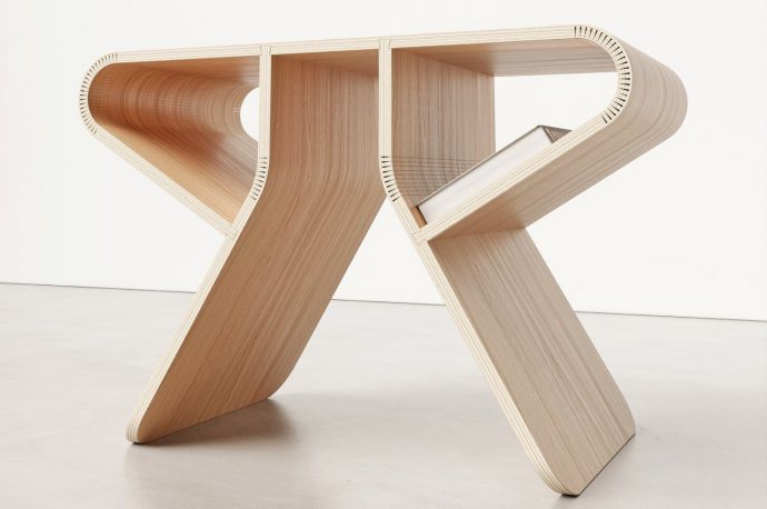 Bent wooden stool requires no screws or hinges to assemble from flat packaging
