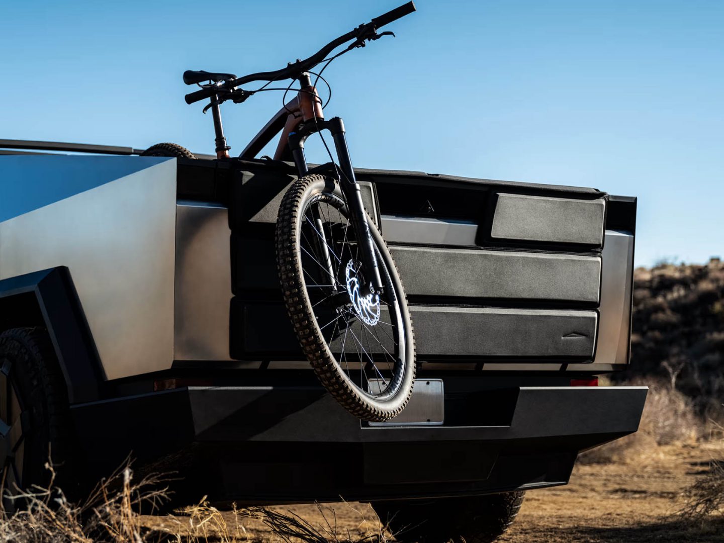 Tesla unveils tailgate shield and jumpseat for Cybertruck owners