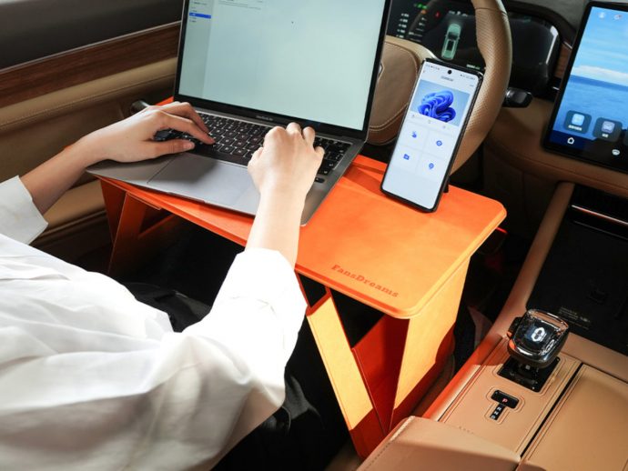 Origami-inspired foldable laptop desk also functions as a car table and food tray