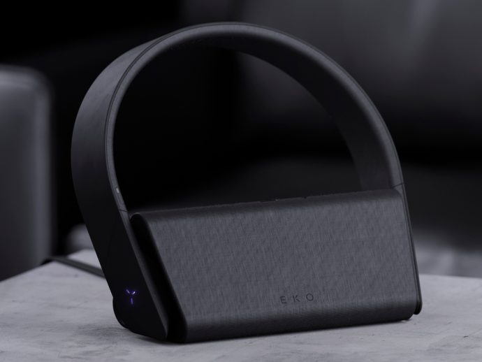 Wireless headphones concept sits on a charger that doubles as a speaker