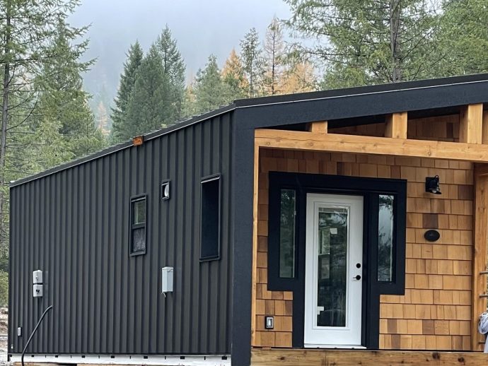 This Wooden Rugged Home Is Blessed With An Excellent Built-In Front Patio