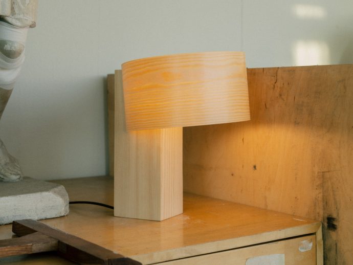 Minimalist wooden lamp showcases contrasting properties of pine