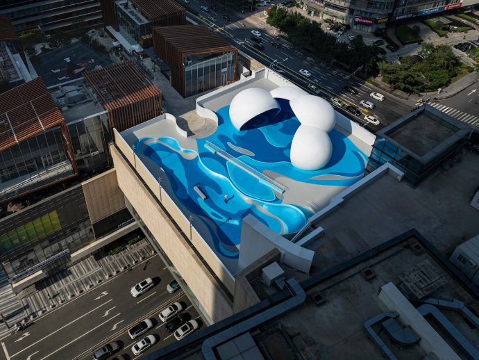 Ocean-inspired rooftop skate park artfully connects earth, sea, and sky