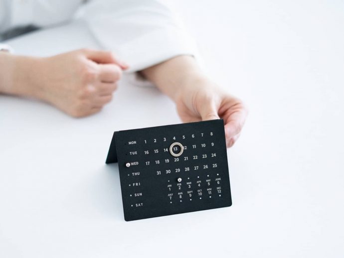 Perpetual metal plate calendar lets you create a ritual to adjust the date