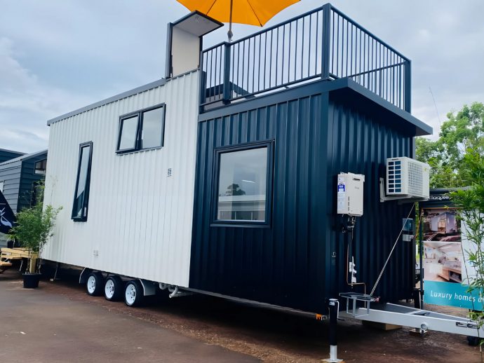 This Contemporary Tiny House Maximizes Space With Light Interiors & A Rooftop Lounge