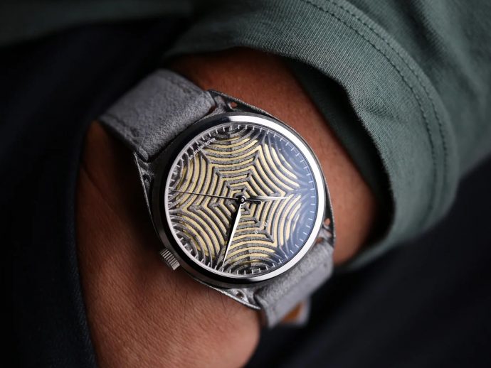 Apiar Gen 1.0 features 3D printed textured, web-like dial inside solid titanium casing