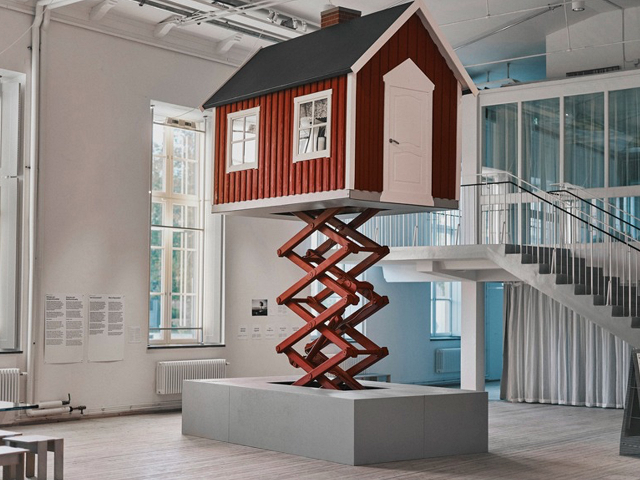 This Red Cottage Rises 20 Feet On A Scissor Lift When Floods Strike - Yanko Design