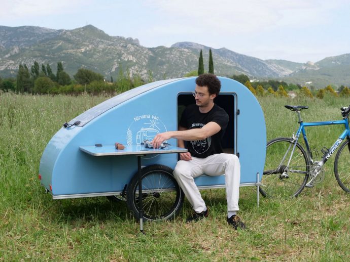 This teardrop trailer with fiberglass body tows efficiently behind an electric bike