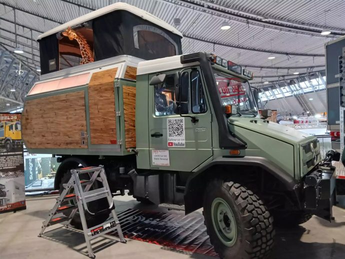 This Unimog-based wooden cabin with pop-up roof tent is built for the wilderness
