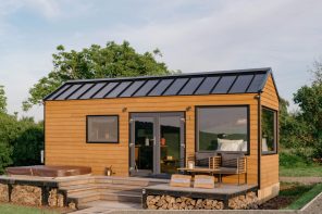 This $93K Tiny House Has a Cinema Screen That Drops Over the Windows