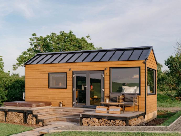 This $93K Tiny House Has a Cinema Screen That Drops Over the Windows