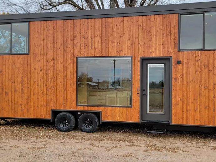 This All-Electric Tiny Home Has Floor-to-Ceiling Glass, Two Lofts, and Still Fits on a Trailer