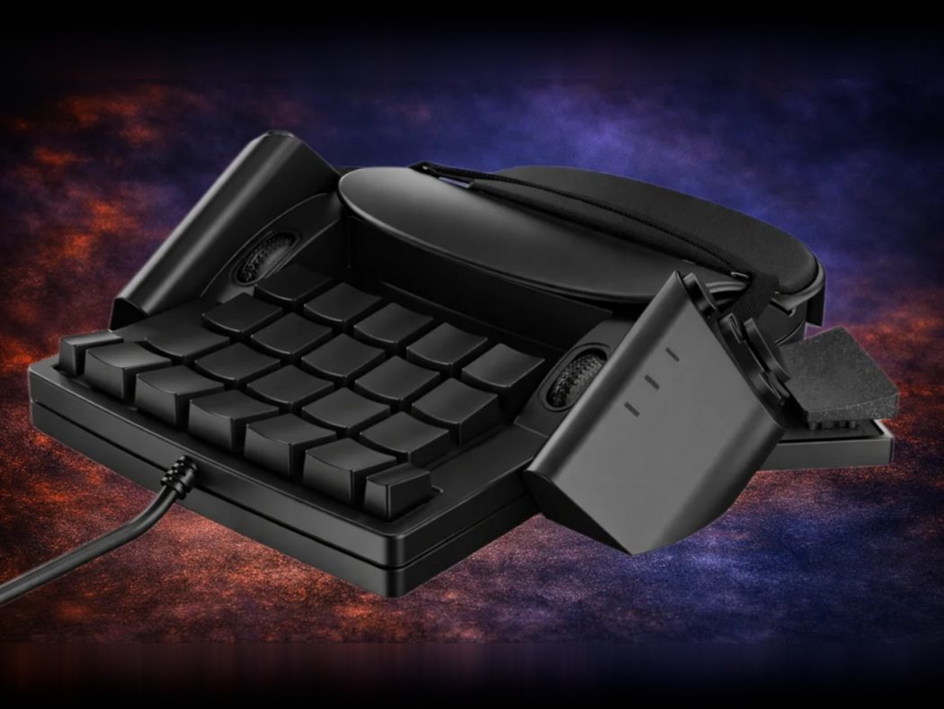 Black retro keyboard with a vintage telephone handset resting on top, cord trailing to the left, set against a dark, colorful background.