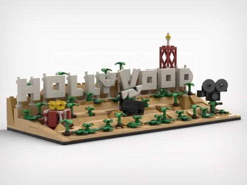 LEGO diorama spelling HELLO WORLD on a sandy desert base with palm trees and a red tower.