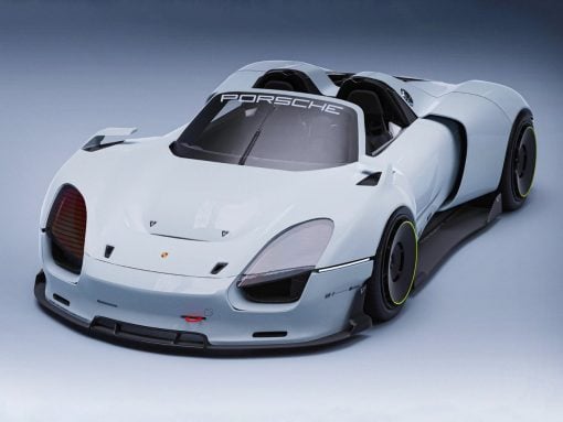 White futuristic Porsche race car with open cockpit, angled from the front-left, showing aerodynamic body and neon-green-wheel rims