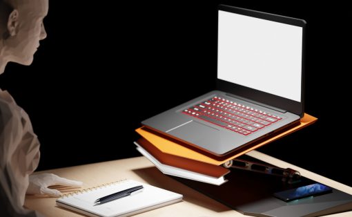 Abstract figure at a desk with a laptop perched on a stack of orange folders, plus a notebook, pen, mouse, and smartphone nearby.