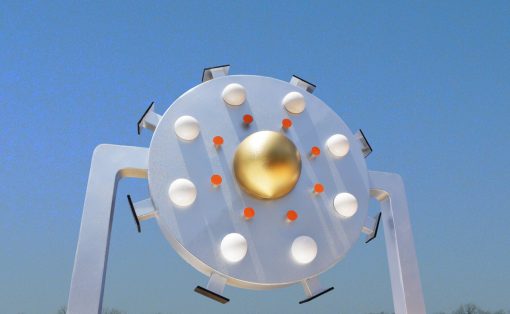 Outdoor circular metal sculpture with a gold central sphere and surrounding white lights against a blue sky, mounted on a white frame.