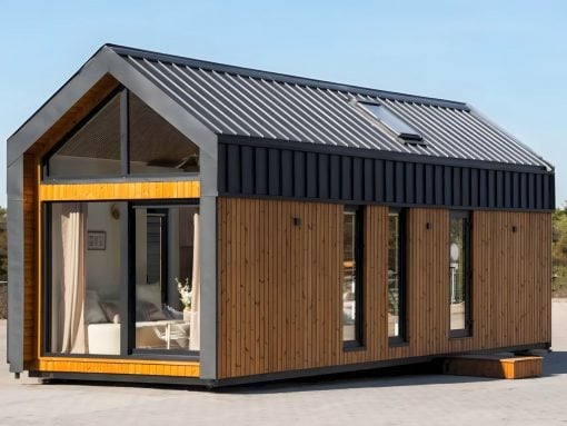 Modern tiny house with vertical wooden siding, a black metal roof, and a wide glass front window.