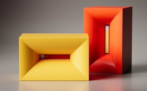 Two hollow rectangular prisms, yellow in front and orange-red behind, with concave inner walls and slim inserted bars visible inside each.