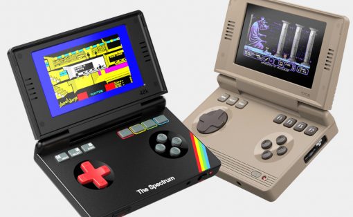 Two vintage handheld game consoles from the 1980s: a black Spectrum-style device with a red D-pad and rainbow stripe, and a beige handheld with a screen and multiple buttons on the side.