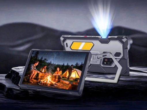 Rugged handheld device with a protective case, projecting a blue beam while the screen shows friends around a campfire at night.