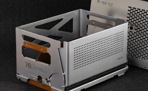 Industrial metal computer chassis with wooden handles and perforated side panels, shown on a dark backdrop.