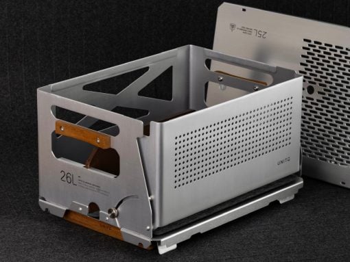 Industrial metal computer chassis with wooden handles and perforated side panels, shown on a dark backdrop.