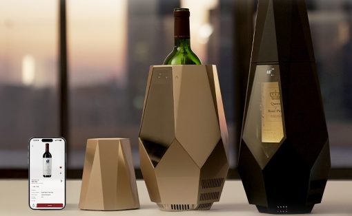 Geometric wine chillers with a bottle centered between a beige and a tall black unit; a smartphone on the left shows a wine product page.