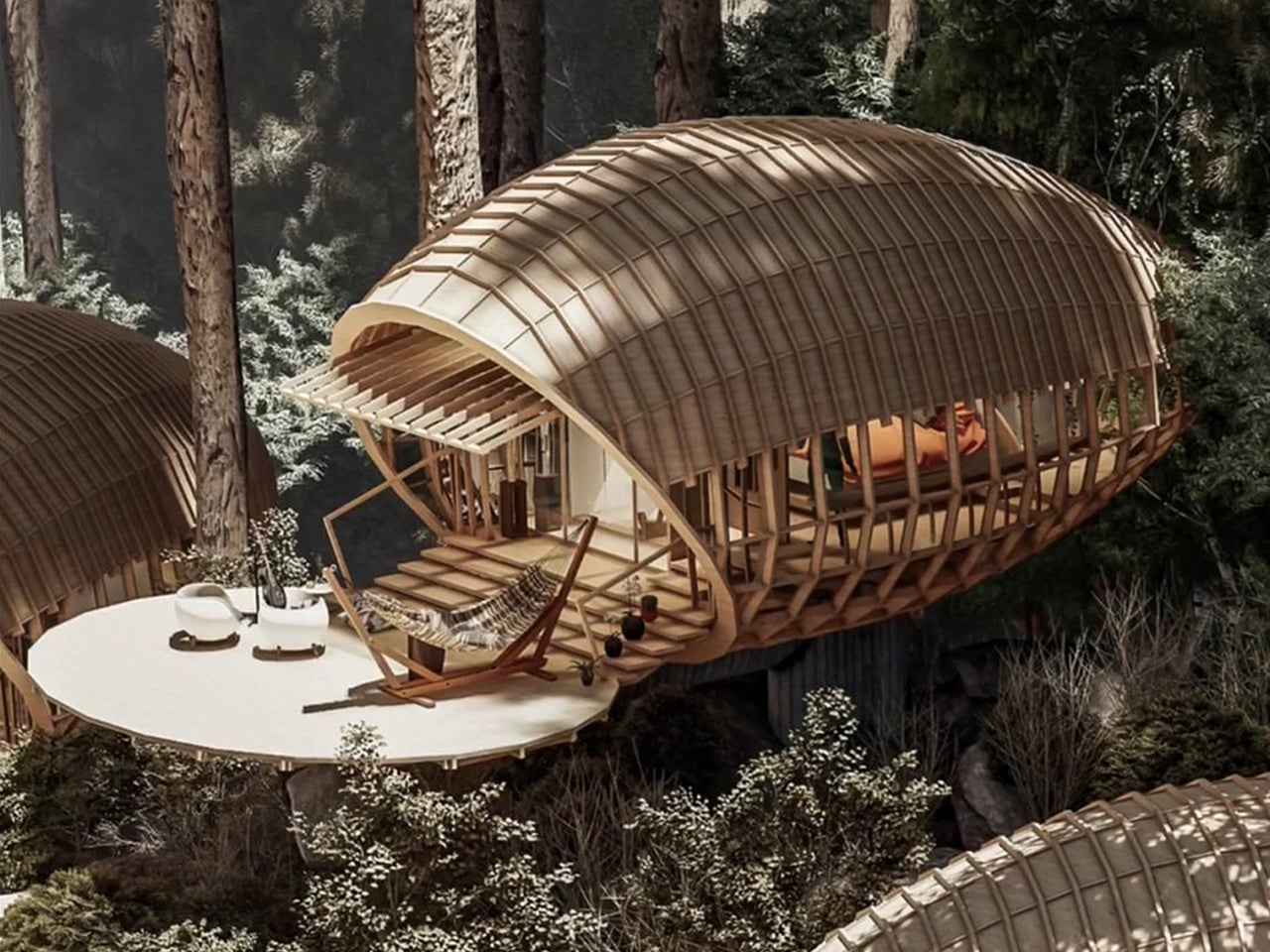 Wooden treehouse pod with curved lattice shell, overlooking a forest, featuring a round deck and lounge chairs on the patio.