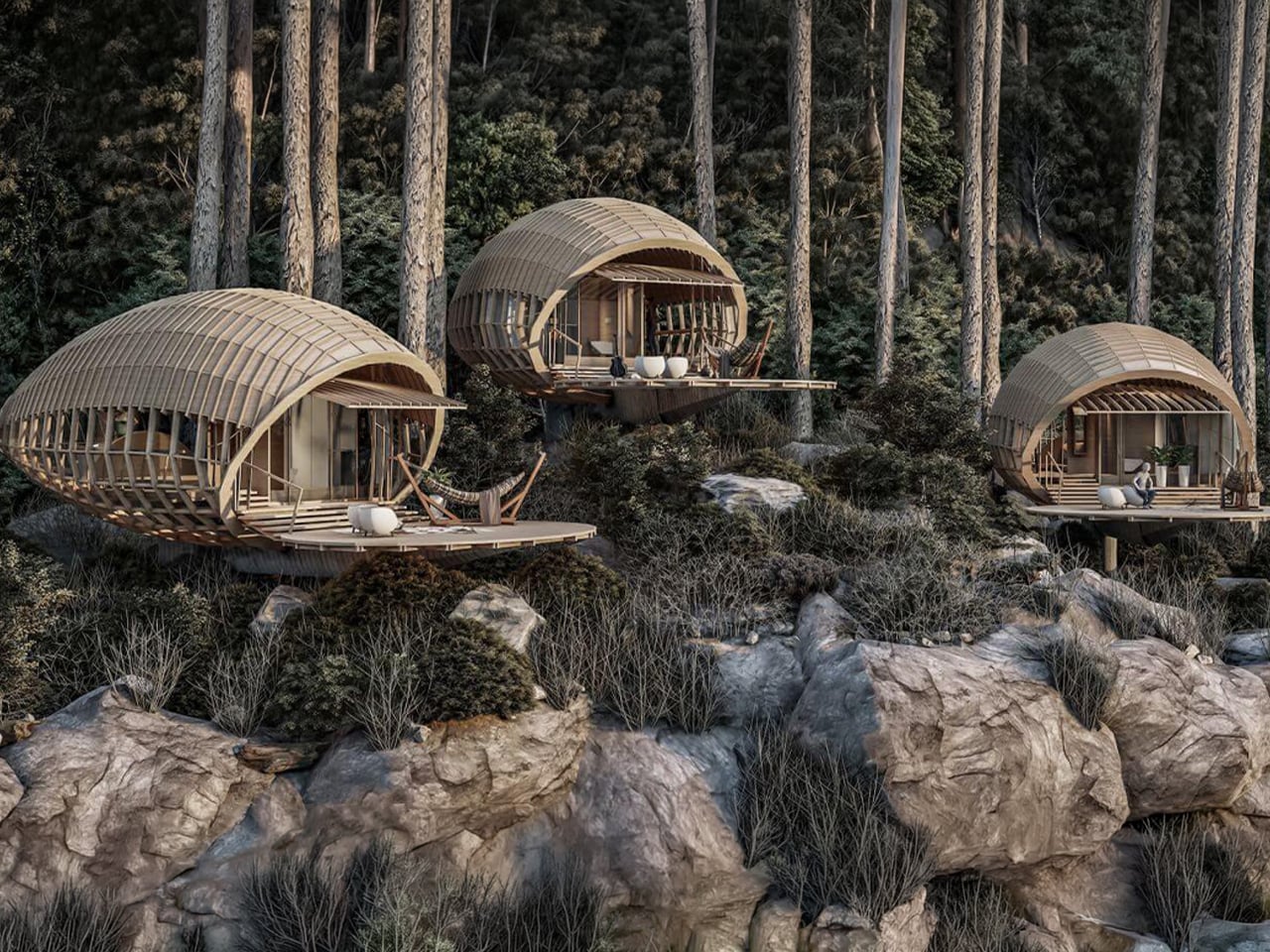 Three rounded wooden cabins perched on a rocky cliff edge among pine trees, connected by decks with chairs and loungers.",