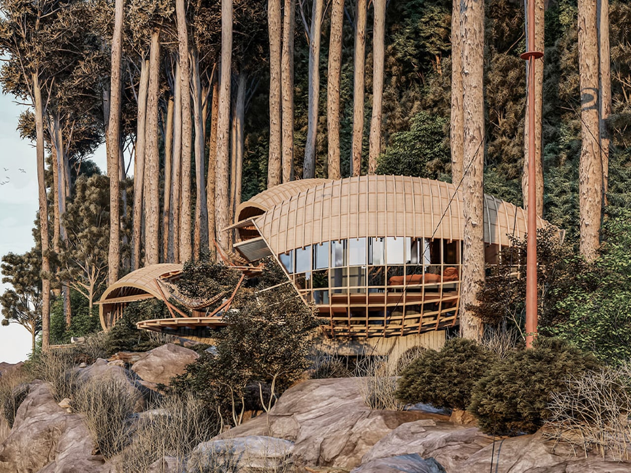 Circular wooden pod house with curved lattice roof nestled among tall trees on a rocky hillside.