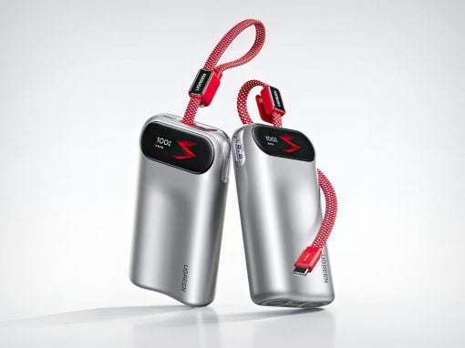 Two silver portable chargers with black screens displaying 100%, connected by red braided straps on a light background.