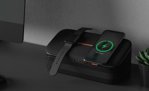 Black wireless charging dock powering a smartwatch and an iPhone; the phone shows a green charging indicator at 95%.