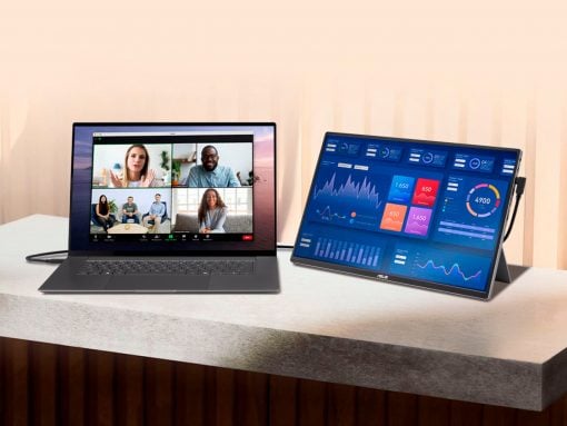 Two laptops on a light desk; left screen shows a four-person video conference grid, right screen displays a blue data dashboard.