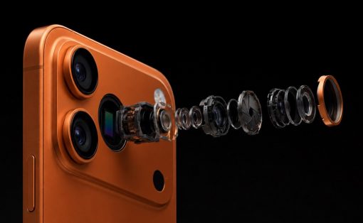 Exploded view of an orange iPhone camera, showing lenses and internal components lined up in space against a black background and a phone edge on the left.