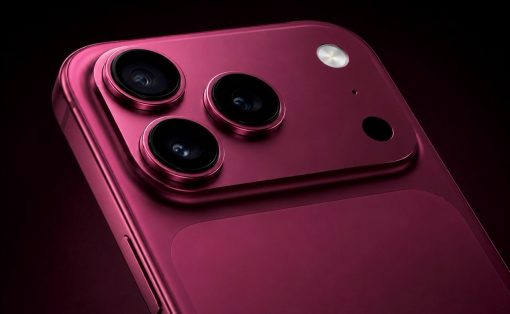 Close-up of a pink smartphone back featuring a triple-camera module and a small flash on a dark background, highlighting the lenses and metal rim.