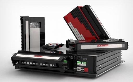 A retro video cassette recorder built from stacked VHS tapes, labeled 'Movie' and 'Cartoon'.