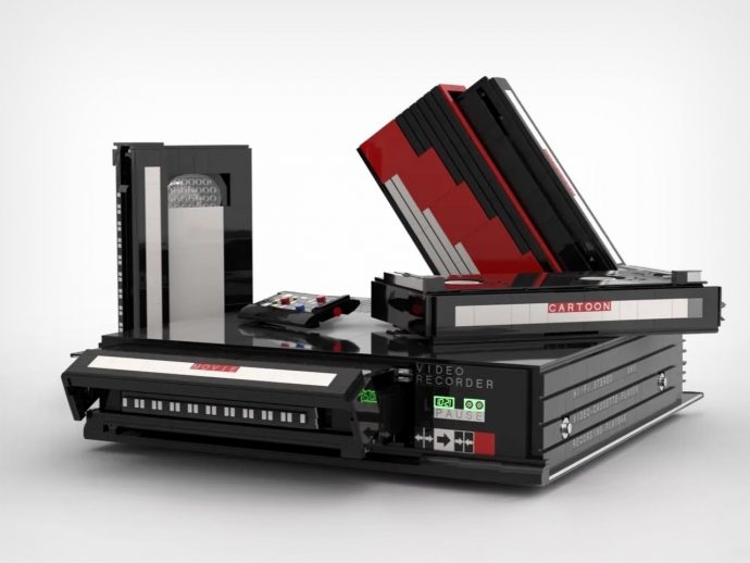 A retro video cassette recorder built from stacked VHS tapes, labeled 'Movie' and 'Cartoon'.