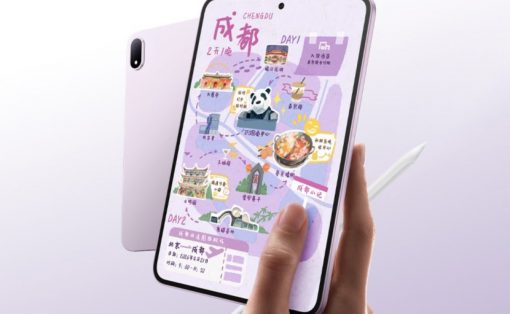 Hand holding a pink tablet displaying a colorful illustrated map with landmarks and icons.